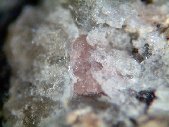 Tugtupite crystals - click for larger pic